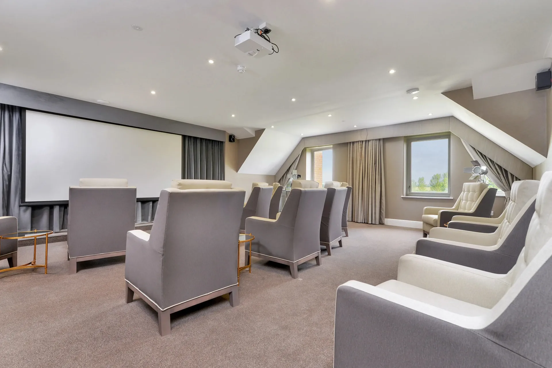 Cinema room with seating and projector screen