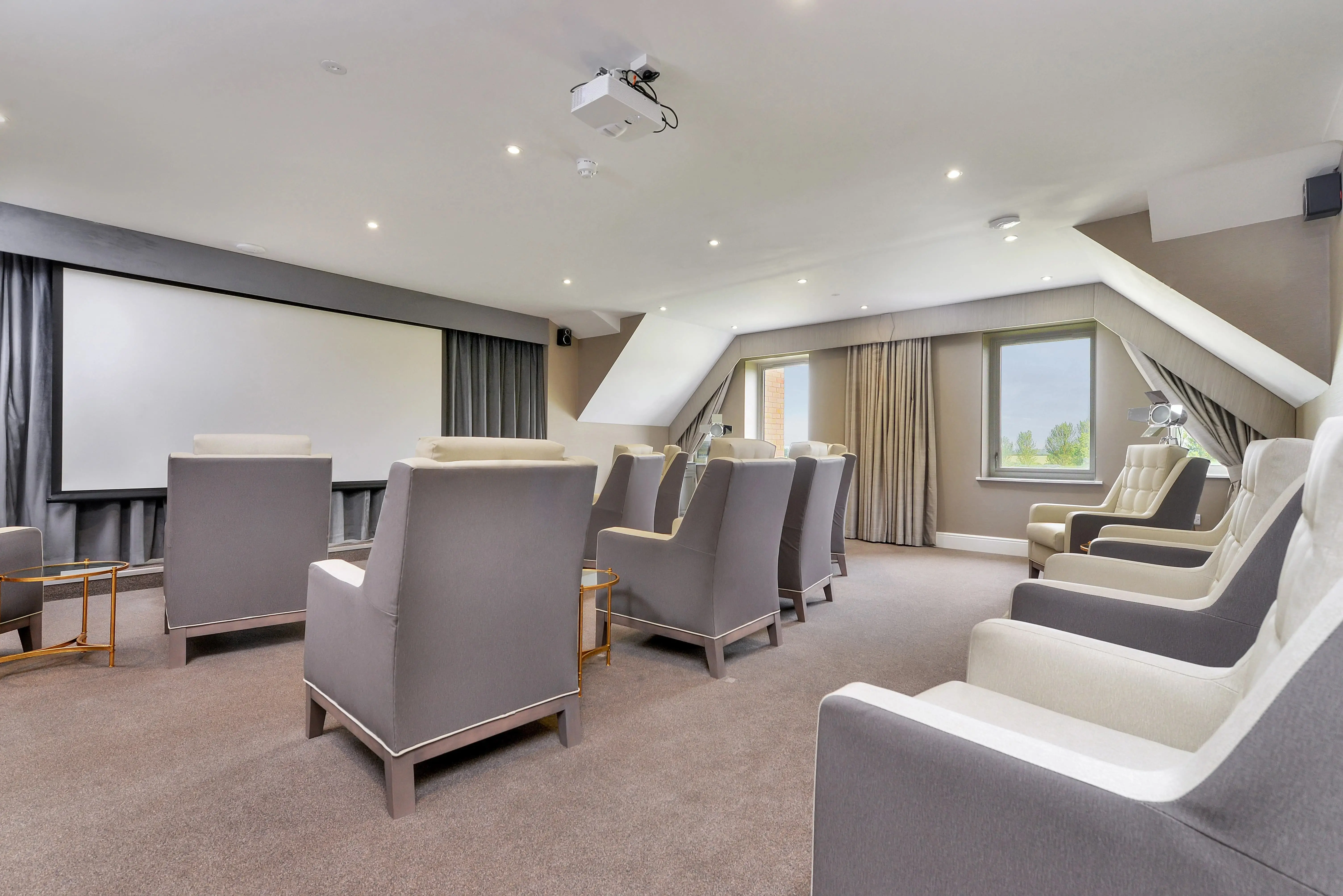 Cinema room with seating and projector screen
